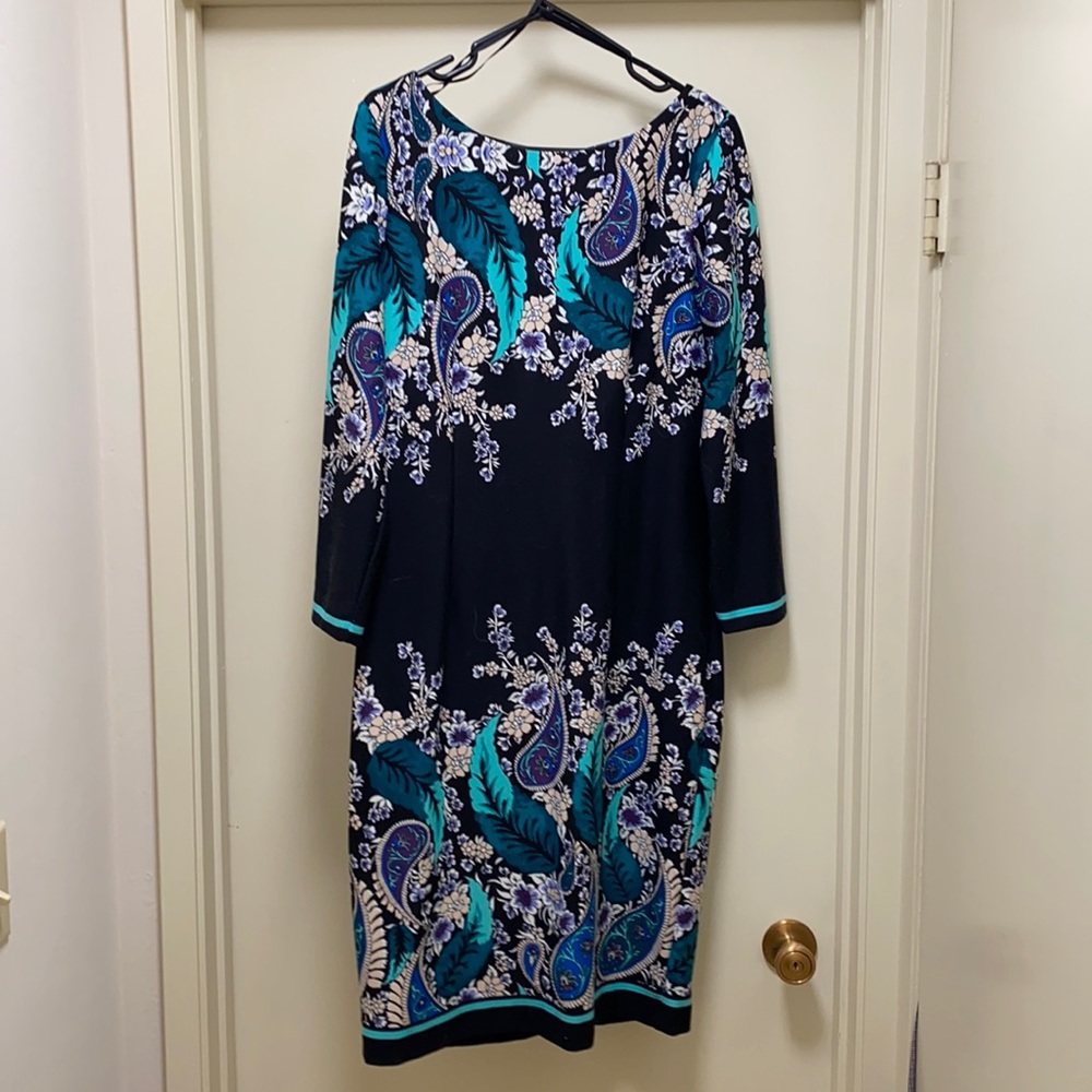 Black floral dress with gold zipper detail.